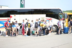 Boys unload their gear from the buses before preparing for their first night at SUNY Morrisville.